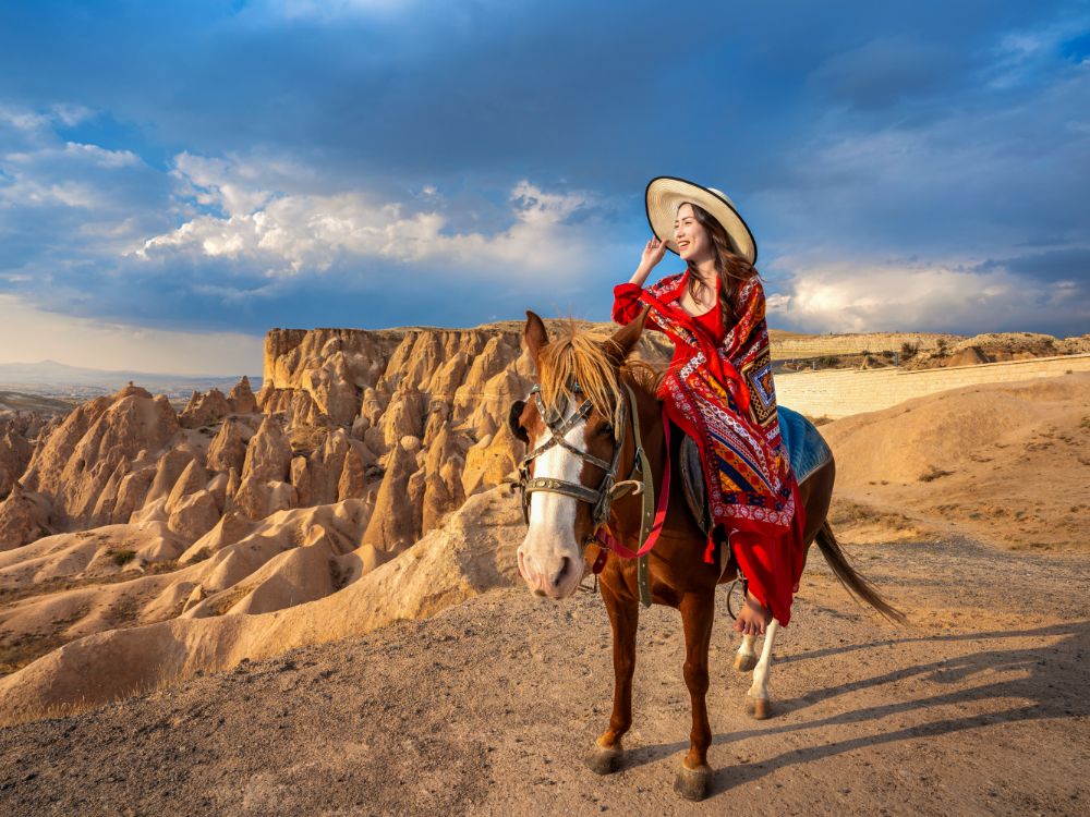 tourists enjoy ride horses cappadocia turkey